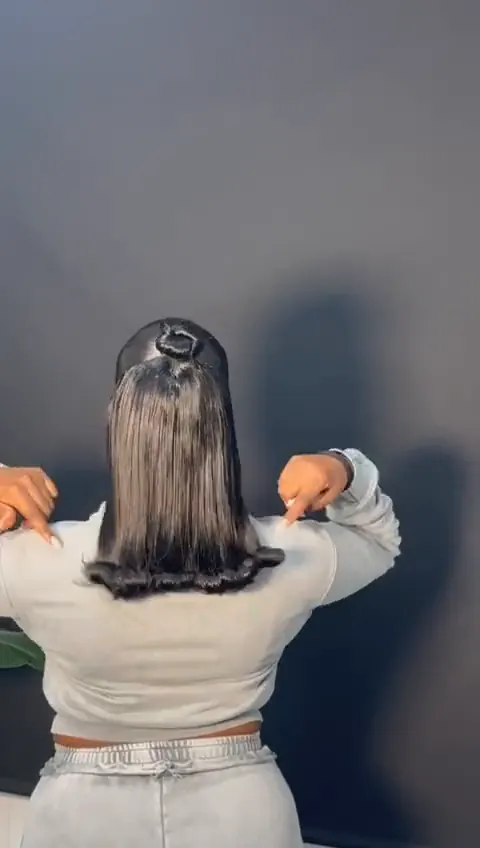 Back view of a half up, half down with curled ends